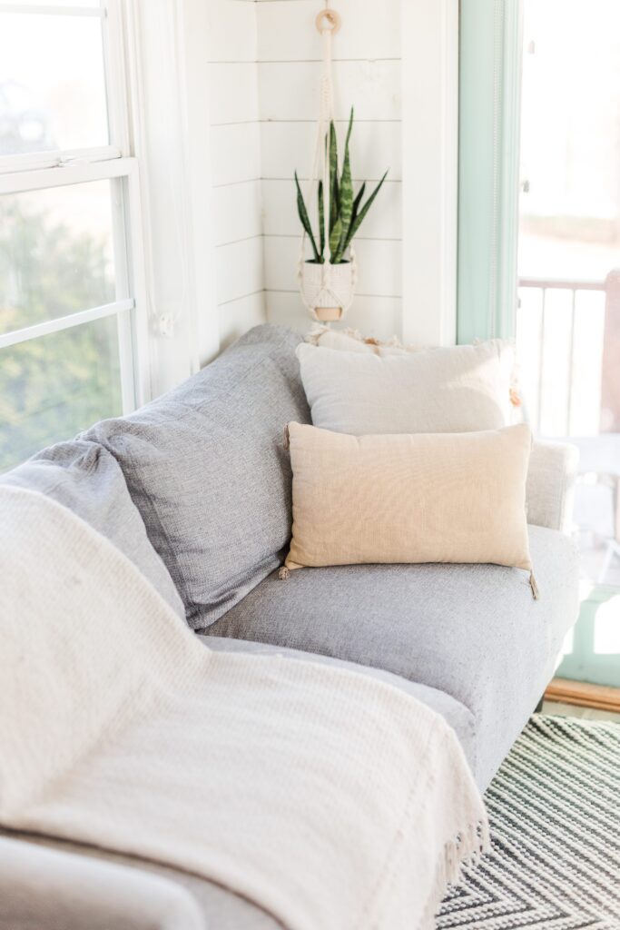 day in the life holistic lifestyle branding session photos, cozy couch in a tiny house