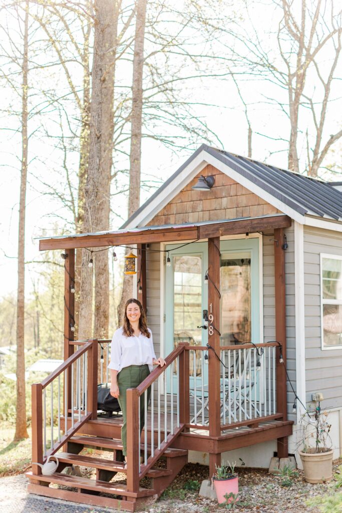 day in the life holistic lifestyle branding session photos, standing on the front steps of her tiny house