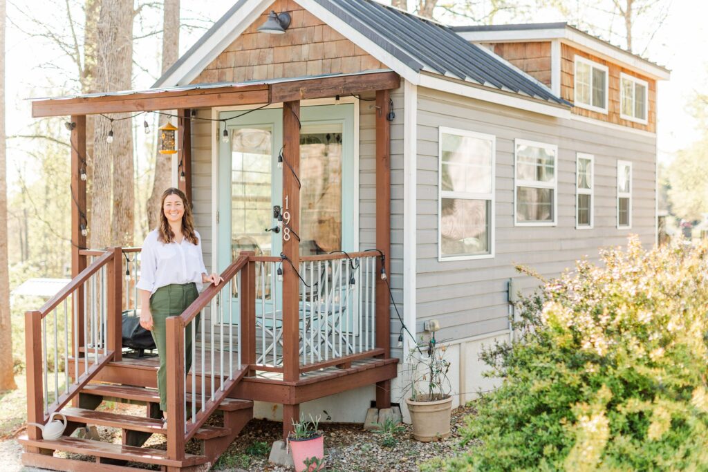 day in the life holistic lifestyle branding session photos, standing on the front steps of her tiny house